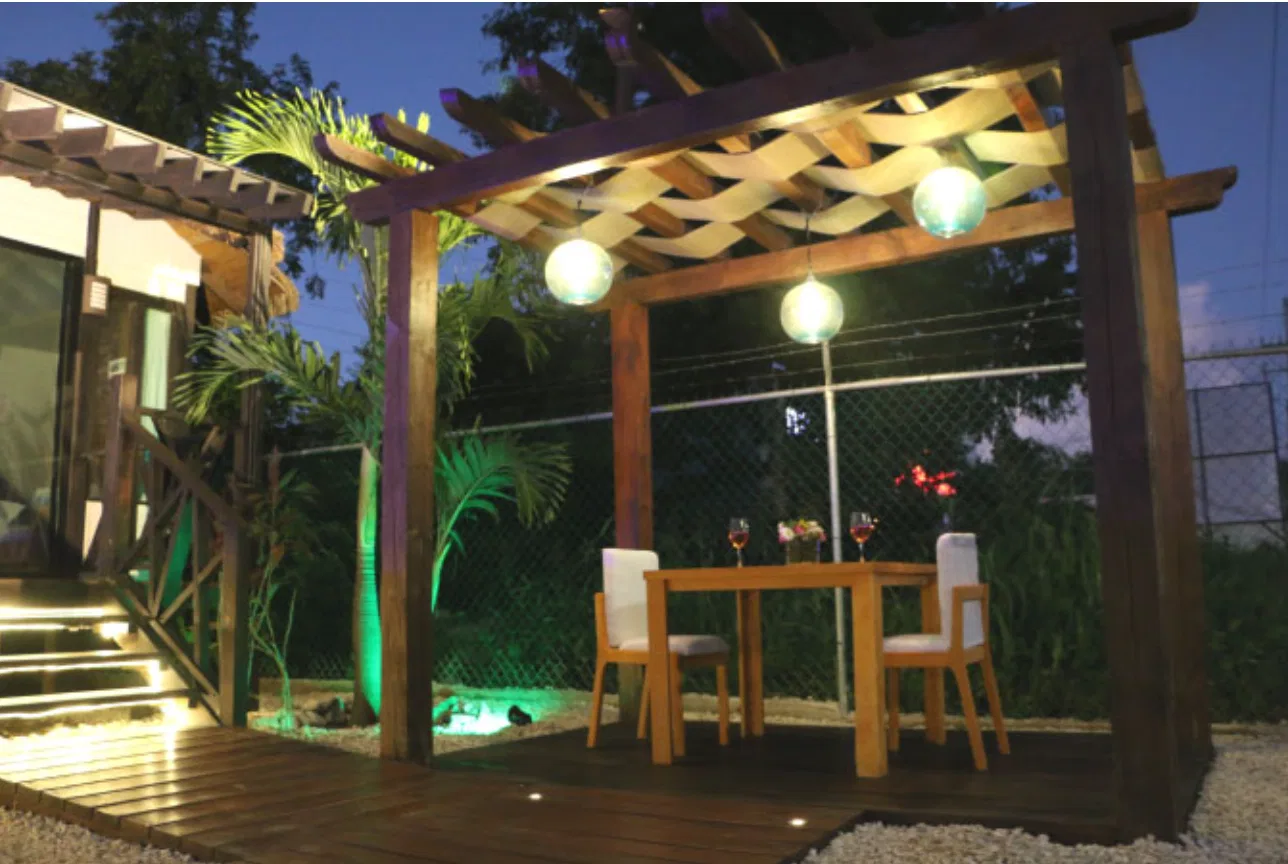 Timber pergola at dusk in a reference property