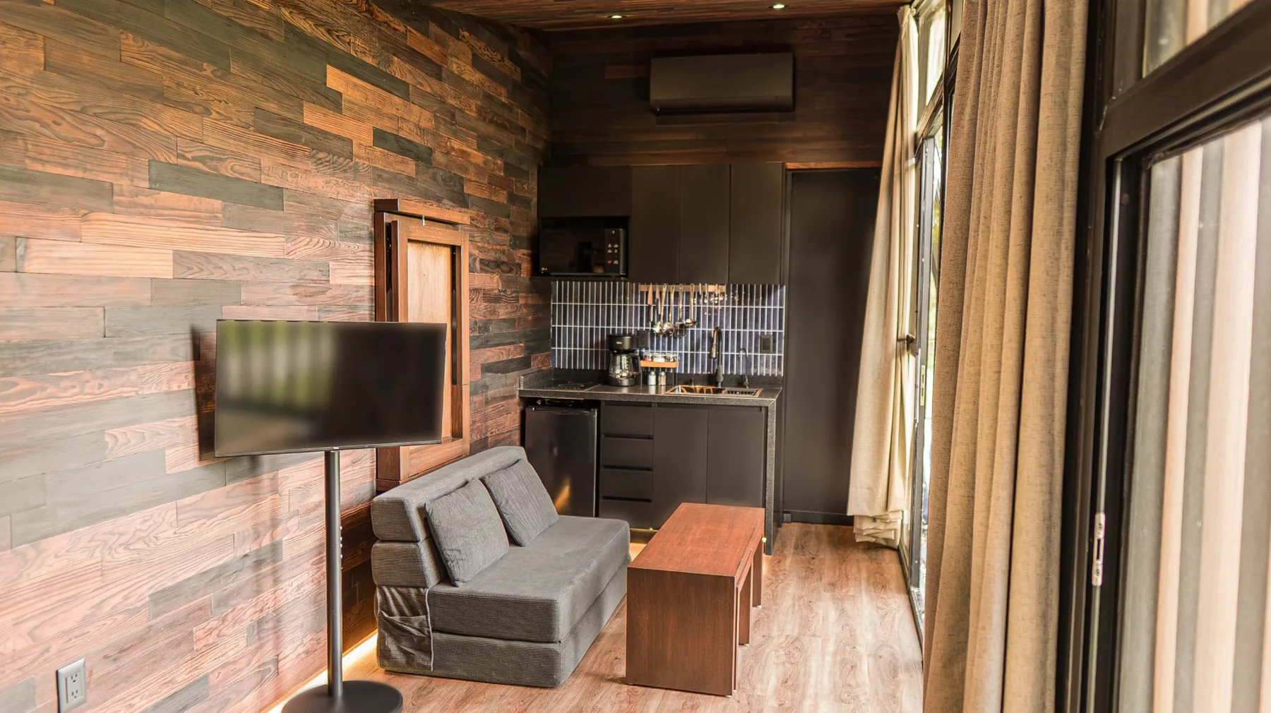 NOMAD living area and compact kitchen